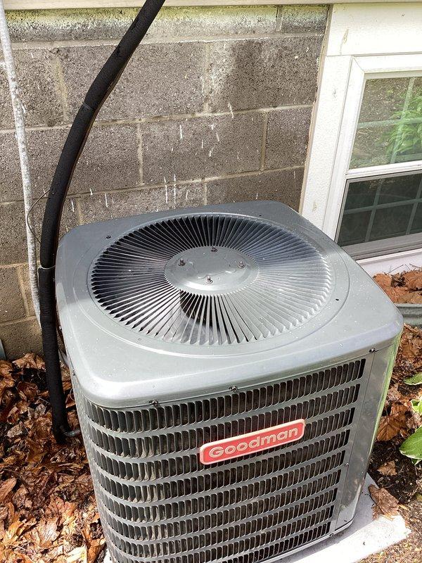 Completed preventive maintenance on Goodman residential air conditioning condenser unit. Performed standard cooling season inspection including visual assessment of electrical disconnect, refrigerant line sets, condenser coil fins, and fan assembly. Unit found in operational condition with all components functioning properly and no immediate service needs identified.