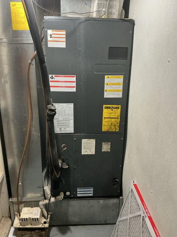 # HVAC Cooling Maintenance Summary

Completed routine preventive maintenance on residential split-system air conditioning unit as part of ongoing recurring service agreement. Inspected indoor air handler unit located in basement utility area, verifying proper operation of all electrical connections, refrigerant lines, and condensate drainage system. Evaluated outdoor condensing unit, noting significant deterioration of refrigerant line insulation with extensive cracking, peeling, and exposure of underlying materials due to weather exposure and age. Equipment operational at time of service with all components functioning within normal parameters. Documented current condition of system through photographic records for maintenance history. Recommended monitoring of degraded line insulation for potential replacement to maintain energy efficiency and prevent refrigerant line damage.