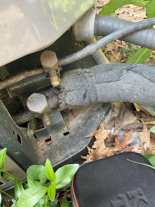 # HVAC Cooling Maintenance Summary

Completed routine preventive maintenance on residential split-system air conditioning unit as part of ongoing recurring service agreement. Inspected indoor air handler unit located in basement utility area, verifying proper operation of all electrical connections, refrigerant lines, and condensate drainage system. Evaluated outdoor condensing unit, noting significant deterioration of refrigerant line insulation with extensive cracking, peeling, and exposure of underlying materials due to weather exposure and age. Equipment operational at time of service with all components functioning within normal parameters. Documented current condition of system through photographic records for maintenance history. Recommended monitoring of degraded line insulation for potential replacement to maintain energy efficiency and prevent refrigerant line damage.