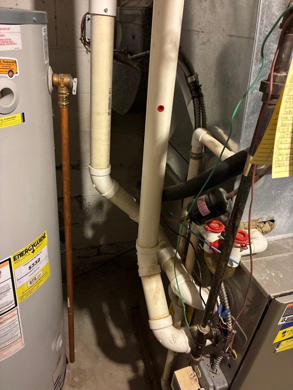 Evaluated existing Carrier furnace and HVAC system configuration in basement utility room and provided equipment replacement options for the smaller capacity system serving the right side of the residence. Assessed current installation including ductwork connections, refrigerant line routing, condensate drainage, and clearance requirements for future replacement considerations.