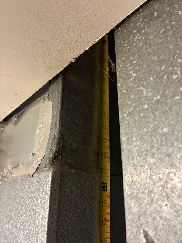 Conducted comprehensive HVAC system replacement estimate for residential property. Evaluated existing outdoor condensing unit located in under-deck crawlspace area with significant leaf debris accumulation around equipment, assessed accessibility challenges due to wooden structural supports and confined workspace. Documented interior measurements of existing system components and examined door frame clearances for equipment removal and new installation access. Presented multiple air conditioning replacement options and discussed complete system configuration alternatives with property owner.