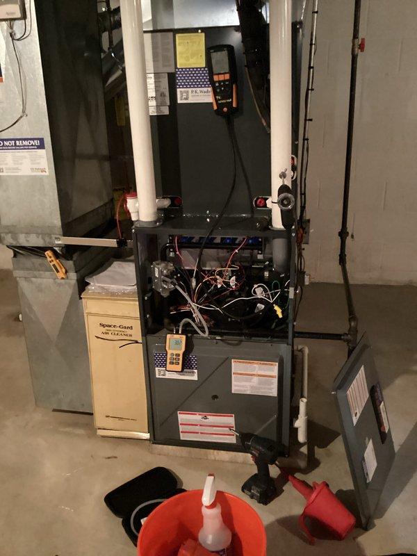 Completed annual maintenance visit for both heating and cooling systems. Performed comprehensive inspection of furnace and air conditioning unit, including electrical connections, airflow components, and Space-Gard air cleaner. Verified system operations with digital multimeter readings, checked all safety controls, and confirmed proper venting and drainage functionality. Both systems operating within normal parameters with no issues identified.