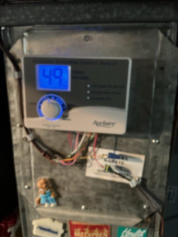 Completed scheduled cooling maintenance service on two HVAC systems. Performed comprehensive inspection of both units, including air filter replacement on system with pleated media filter in attic location. Verified proper operation of Aprilaire humidifier control displaying normal humidity levels at 99% on digital readout. Inspected all electrical connections, wiring terminals, and control components for secure mounting and proper function. Both systems operating within normal parameters with no deficiencies noted at time of service.