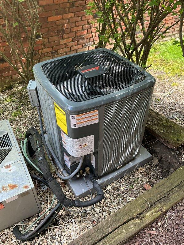 Completed scheduled HVAC cooling maintenance on residential air conditioning system. Performed comprehensive inspection of outdoor condenser unit, including examination of compressor operation, refrigerant lines, electrical connections, and condenser coil condition. Verified proper airflow through unit louvers and confirmed fan motor operation. Documented equipment condition with photographic evidence showing unit installed on concrete pad with appropriate clearances. Also inspected water heater installation and associated plumbing connections during service visit to ensure overall system functionality.
