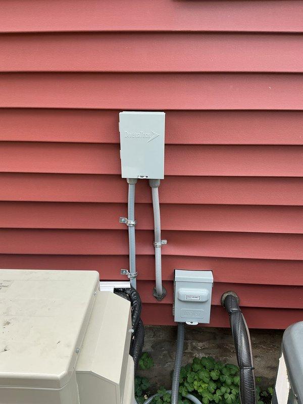 Completed electrical installation for exterior utility service upgrade. Installed new service panel with proper conduit routing from exterior meter enclosure through building envelope. Mounted weatherproof electrical boxes and meter housing on exterior siding with appropriate conduit connections running to grade level. Configured interior main breaker panel with updated circuit directory labeling all branch circuits including major appliances such as dryer, dishwasher, washer pump, kitchen receptacles, and office circuits. All conduit secured with proper clamps and brackets per code requirements. Verified all connections and tested panel operation.