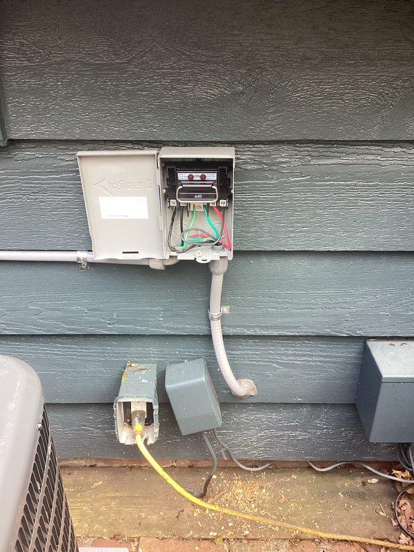 Ran new electrical circuit from existing service panel with breaker modifications to supply power to workshop area. Installation included routing cable through finished spaces, installing junction box with appropriate circuit protection, and mounting new lighting fixture with pegboard work area. Exterior electrical panel was accessed and modified to accommodate additional circuit load, with proper conduit installation and wire terminations completed per code requirements.