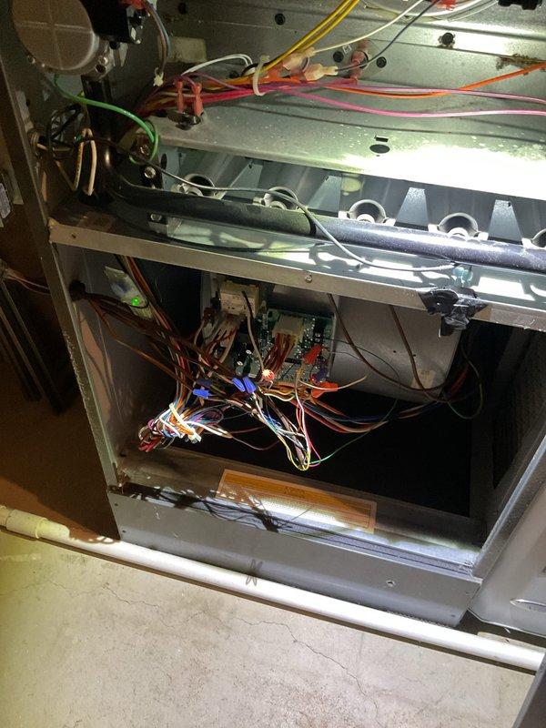 Responded to service call for air conditioning system reportedly damaged during recent hail storm. Performed thorough inspection of both indoor air handler and outdoor condensing unit, documenting internal components and electrical connections. Assessed condenser unit for hail damage to cabinet, coil fins, fan assembly, and electrical compartment, finding system components intact with wiring and capacitor connections secure.