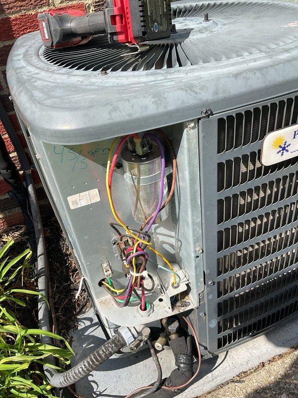 Responded to service call for air conditioning system reportedly damaged during recent hail storm. Performed thorough inspection of both indoor air handler and outdoor condensing unit, documenting internal components and electrical connections. Assessed condenser unit for hail damage to cabinet, coil fins, fan assembly, and electrical compartment, finding system components intact with wiring and capacitor connections secure.