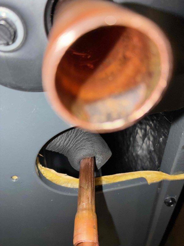 Completed warranty coil replacement on HVAC system. Removed and replaced defective evaporator coil, reconnected refrigerant lines through cabinet penetrations, and sealed all openings with appropriate insulation material. System tested and confirmed operational upon completion.