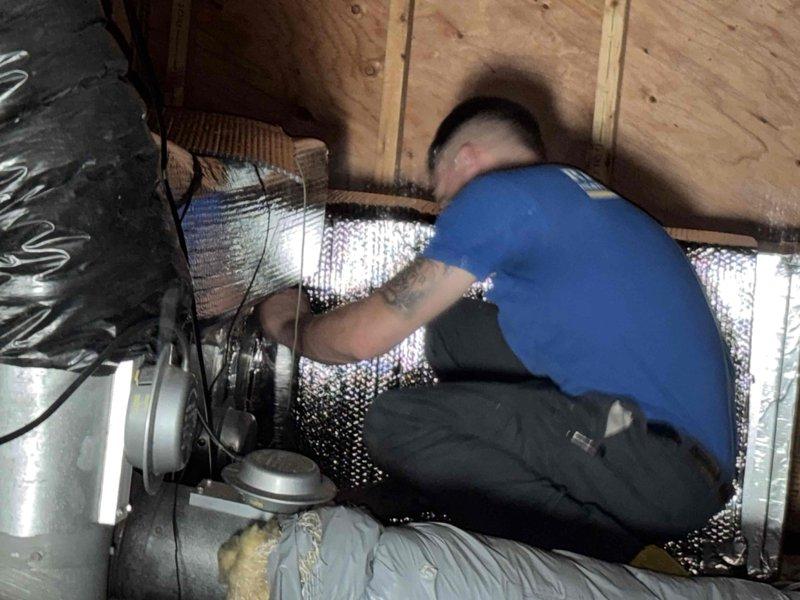 Technician completed attic inspection of HVAC system and ductwork as requested. Installed reflective bubble insulation material in attic space around existing flexible duct runs. Protected work area with cardboard flooring and ensured proper clearance around black corrugated ductwork and electrical wiring. System components and insulation installation verified to be in proper working condition.