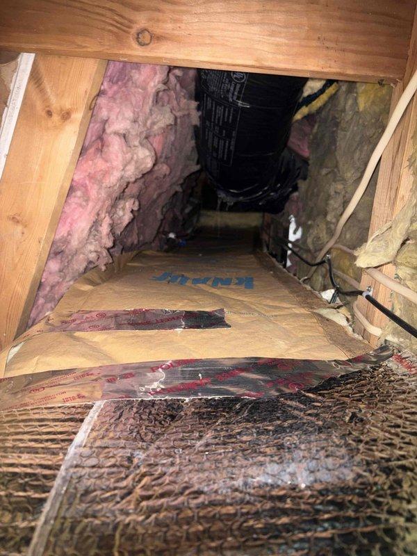 Technician completed attic inspection of HVAC system and ductwork as requested. Installed reflective bubble insulation material in attic space around existing flexible duct runs. Protected work area with cardboard flooring and ensured proper clearance around black corrugated ductwork and electrical wiring. System components and insulation installation verified to be in proper working condition.