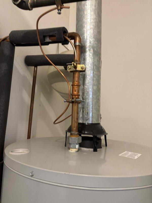 Completed scheduled maintenance on residential tanked water heater, performing a complete flush and fill procedure to remove sediment buildup and maintain optimal system performance. Drained the unit using a garden hose, flushed the tank thoroughly to clear accumulated mineral deposits, and refilled the system. Inspected all copper supply lines, brass valves, and fittings for proper operation and verified the galvanized vent pipe connection at the top of the unit. All plumbing connections remained secure with no signs of leaks or corrosion. System was returned to normal operation with proper water flow and temperature function confirmed.