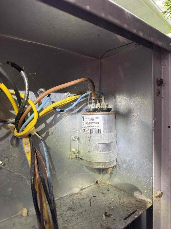 Completed comprehensive cooling system tune-up on residential HVAC unit, including inspection of electrical components, capacitor testing, and overall system performance evaluation. Unit showed normal wear with dust accumulation on electrical connections and enclosure; all components functioning within specifications. Customer requested separate quote for new humidifier installation.