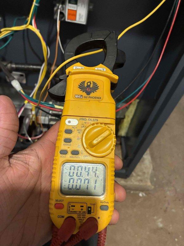 Completed annual maintenance visit on steam boiler system per service plan agreement. Performed comprehensive inspection of boiler control board and electrical components. Tested and recorded amperage draw using clamp meter, confirming proper electrical operation at 0.44 amps. Inspected primary control circuit board assembly, verified all connections secure, and confirmed proper functionality of safety controls and relays. Checked wiring terminals for tightness and signs of heat damage. All system components operating within normal parameters with no issues found requiring immediate attention.