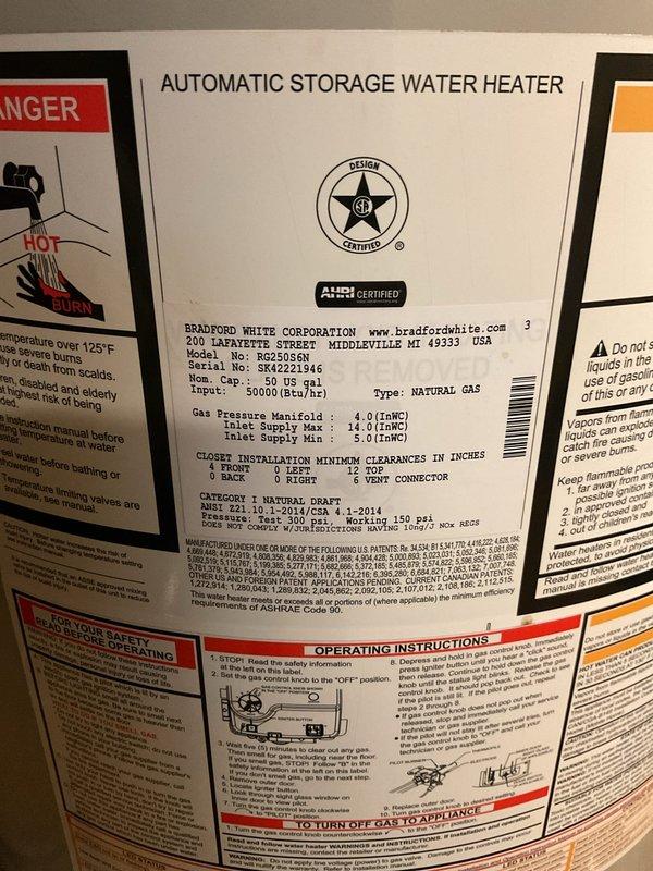 Performed routine maintenance flush on a Bradford White 50-gallon natural gas tanked water heater (Model RG250S6N) installed in basement utility area. Drained sediment and mineral buildup from tank bottom through drain valve to restore heating efficiency and extend equipment lifespan. Inspected unit condition, verified proper operation of gas control valve and temperature-pressure relief valve, and confirmed all plumbing connections and PEX supply lines remained secure with no signs of leakage. Unit returned to normal operation following flush procedure.