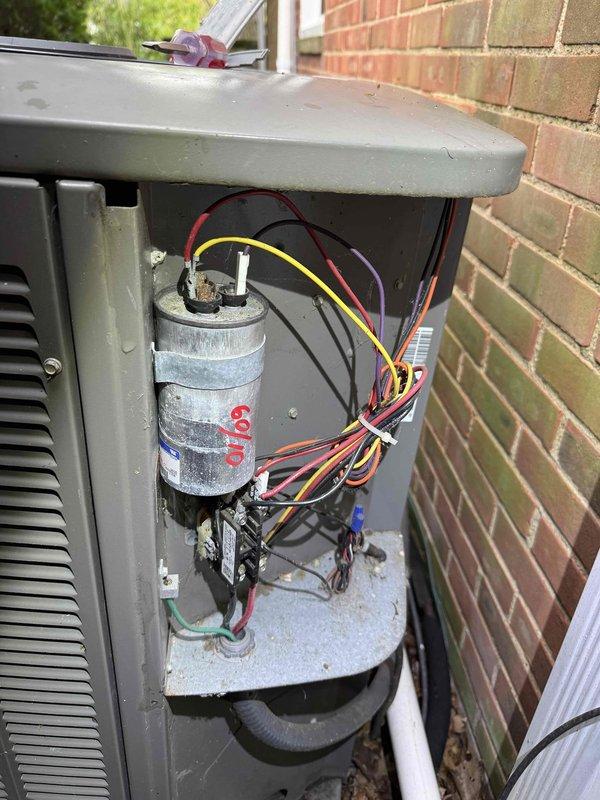 Completed comprehensive cooling system tune-up on residential HVAC unit. Performed thorough inspection of blower motor assembly, verified proper electrical connections, and examined capacitor functionality. Documented equipment condition with interior and exterior component photography, noting normal operational wear and age-appropriate accumulation on outdoor condenser unit.