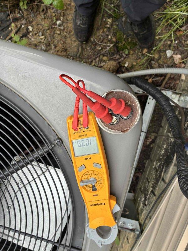 Completed comprehensive cooling system tune-up on outdoor condensing unit. Performed standard maintenance procedures including electrical diagnostics with measured voltage reading of 88.01V, system performance verification, and operational testing. Noted excessive vegetation growth surrounding unit requiring customer attention for proper airflow clearance and future maintenance access.