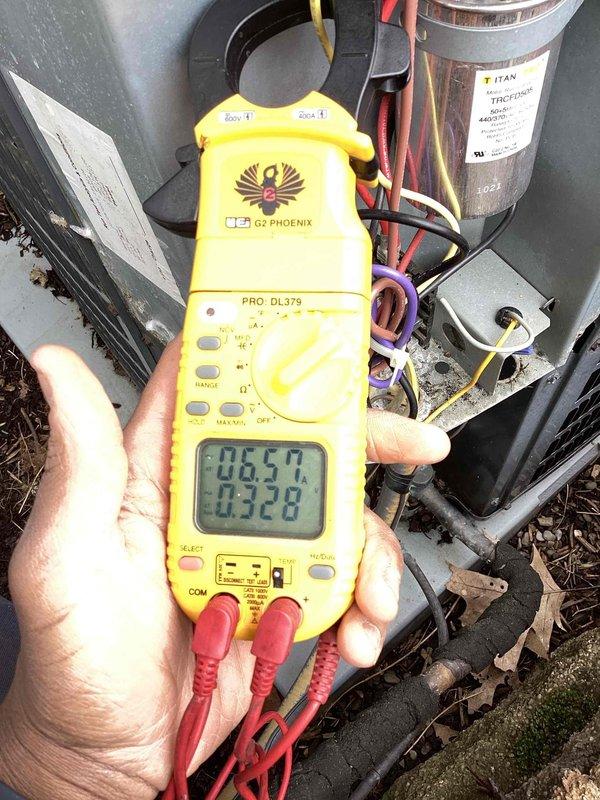 Performed comprehensive cooling system maintenance on HVAC unit. Inspected and assessed blower wheel assembly, confirming proper blade condition and secure mounting with no signs of excessive wear or damage. Conducted electrical diagnostics using clamp meter to verify amperage readings on compressor and system components, checking capacitor performance and electrical connections. All tested components operating within normal parameters.