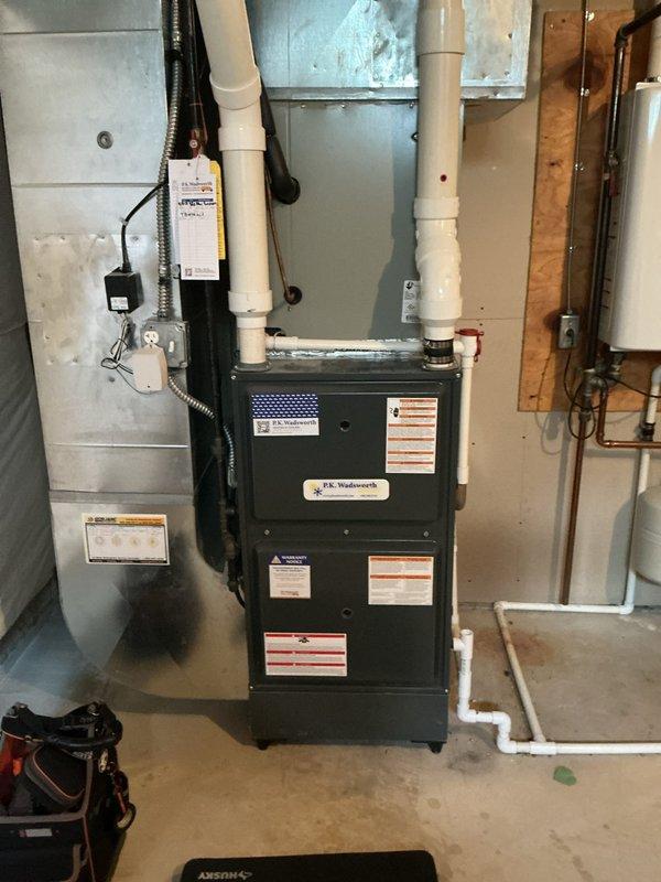 Responded to emergency no-heat call for gas furnace system located in basement. Upon arrival, thermostat was set to 70°F but indoor temperature reading showed 65°F with blower fan running continuously. Performed diagnostic inspection of J.K. Wadsworth furnace unit and associated components including venting system, electrical connections, and control board. Identified and resolved issue preventing proper heating operation. System tested and verified operational with normal heating cycle restored. All safety controls confirmed functioning properly before departure.