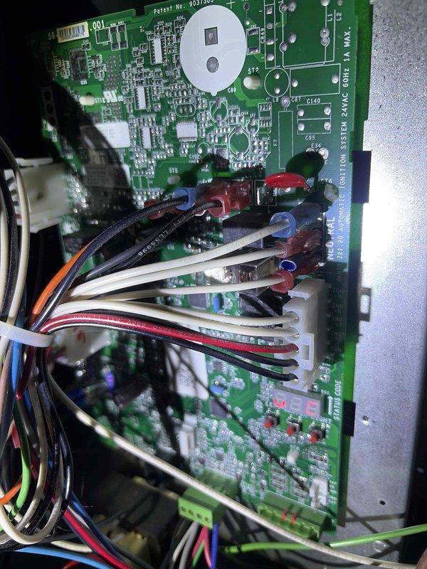 Conducted warranty inspection of newly installed Amana HVAC system. Verified proper operation of digital thermostat displaying cooling mode with accurate temperature and humidity readings, and inspected control board assembly confirming all electrical connections, wire terminations, and circuit board components are secure and functioning correctly.