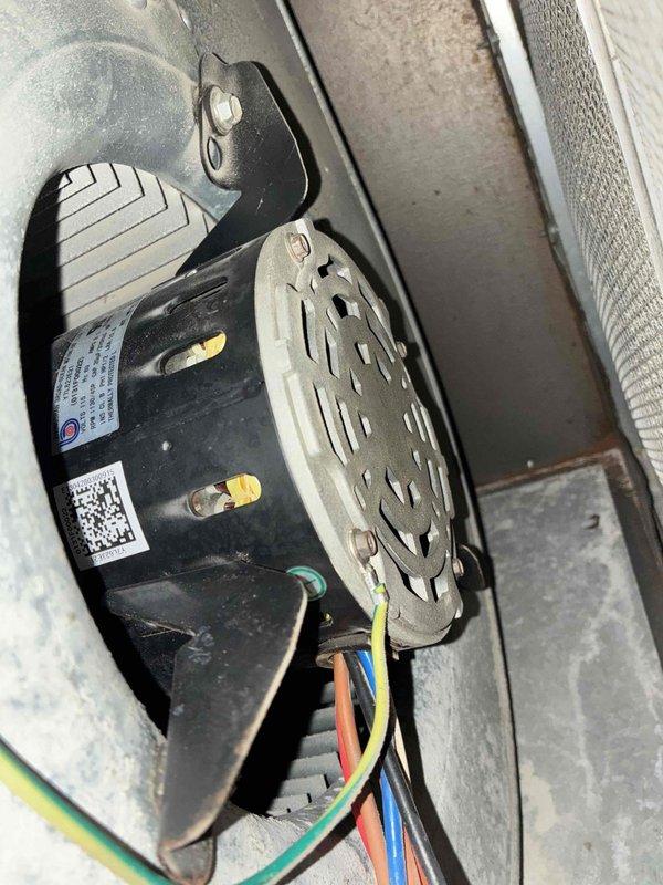 # HVAC Cooling Maintenance Summary

Completed scheduled preventive maintenance on residential cooling system as part of ongoing service agreement. Performed comprehensive inspection of Goodman furnace unit and associated air handling components, including blower motor assembly and ductwork system.

# Detailed Work Performed

Conducted thorough visual inspection of furnace unit positioned in basement utility area. Verified proper installation and mounting on concrete pad. Examined all manufacturer labels and safety information plates for compliance and legibility. Inspected metal ductwork components and plenum box for structural integrity and proper connections.

Performed detailed assessment of blower motor assembly within air handler housing. Inspected cylindrical motor body, mounting brackets, and manufacturer identification label. Verified blower wheel condition, noting light gray perforated design with radial slot pattern for optimal air movement. Examined all electrical connection