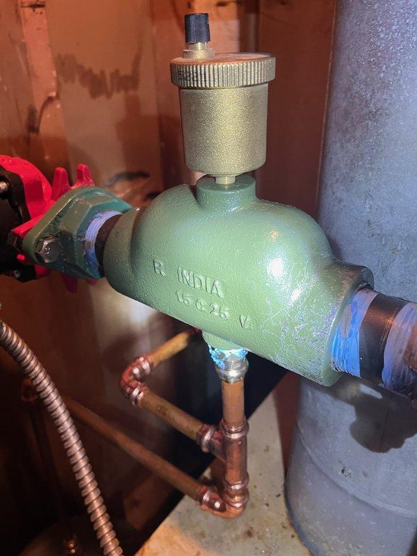 Completed boiler repair involving replacement of pressure reducing valve assembly. Installed new PRV with brass cap and adjustment mechanism on copper supply line. Applied thread sealant tape to threaded connections and soldered copper piping joints to ensure leak-free operation. Tested system for proper water pressure regulation and verified all connections for secure operation.
