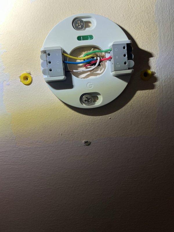 Responded to no heat call on third floor furnace. Upon inspection, found electrical wiring disconnected at thermostat or control junction. Reconnected and secured all electrical connections, including multiple colored conductors with appropriate wire nuts and terminal blocks. Verified proper wire routing and mounting. System restored to normal operation with heat functioning properly.