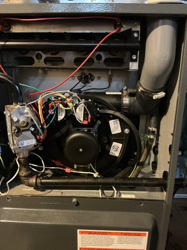 Responded to no heat call on residential furnace system. Upon inspection, accessed unit interior and performed diagnostic testing of heating components. Measured gas pressure at 343 inches water column using differential manometer, indicating significant overpressure condition at gas valve. Normal operating pressure should be between 3.5-4.0 inches water column for natural gas applications. Identified gas valve pressure regulator issue causing dangerous overpressure that prevented burner ignition as a safety measure. Adjusted gas valve regulator to manufacturer specifications and verified proper pressure readings. Confirmed all electrical connections secure, blower motor operational, and heat exchanger intact with no visible damage. Cycled system through multiple heating cycles to verify proper ignition sequence, flame characteristics, and temperature rise. Unit restored to normal heating operation with safe gas pressure levels maintained throughout testing.