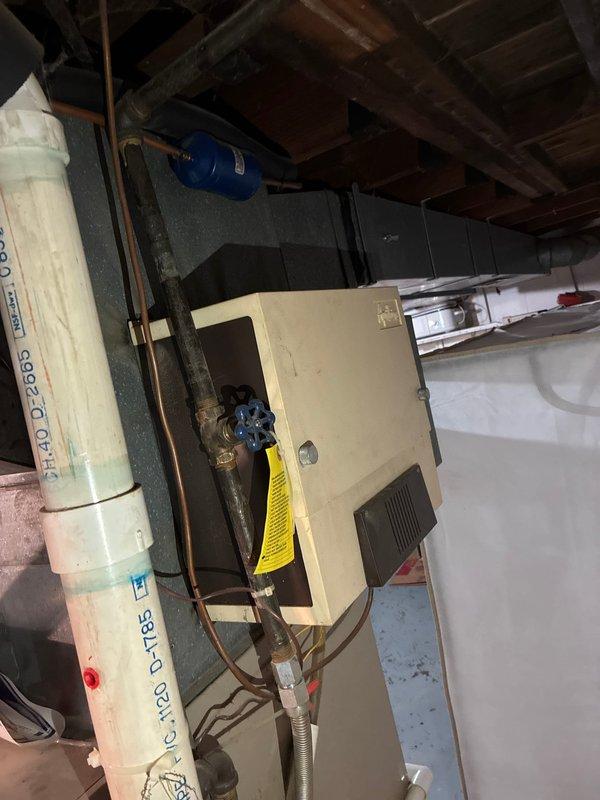 Conducted comprehensive assessment of existing HVAC system and water heating equipment in basement mechanical room to provide full system replacement options. Evaluated current furnace unit with associated ductwork, ventilation hood, and PVC venting configuration, along with existing water heater installation. Documented equipment conditions, clearances, and mechanical room layout including all supply and return ductwork, gas piping with shutoff valves, and existing electrical connections to determine optimal replacement specifications and installation requirements.