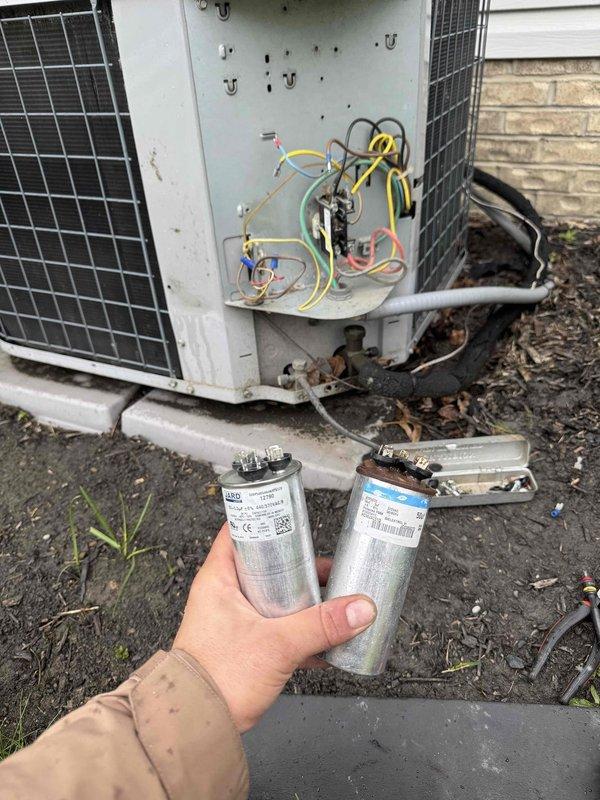 Returned to complete capacitor replacement on residential HVAC system. Removed failed dual-run capacitor from outdoor condensing unit and installed new replacement component, reconnecting all electrical terminals according to manufacturer specifications. Verified proper system operation with temperature readings confirming unit cooling performance at 72.1°F, ensuring restored functionality of the air conditioning system.