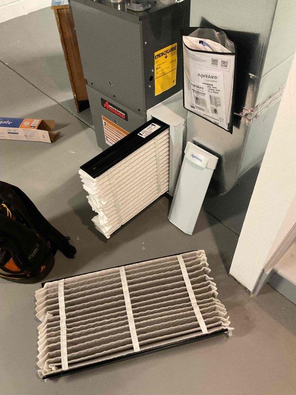 Completed monthly HVAC heating maintenance visit, performing system inspection and filter replacement. Monitored humidifier control settings and verified proper temperature readings throughout the system using calibrated digital measuring equipment. Replaced dirty pleated air filter with new filter to maintain optimal airflow and system efficiency.