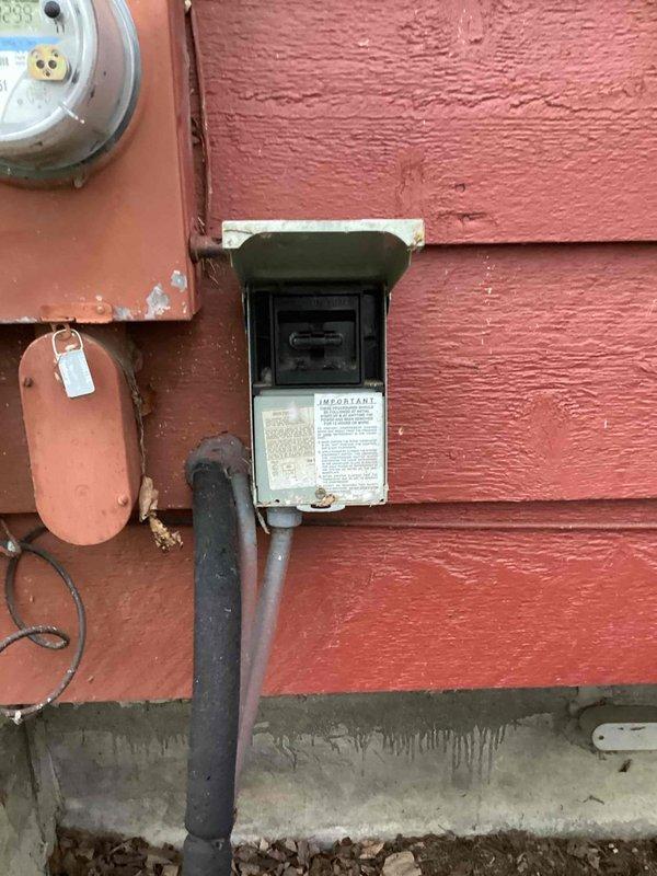 Completed comprehensive cooling maintenance on dual HVAC systems. Inspected and tested dual capacitor (40/5µF, 440VAC) which showed signs of oil leakage and discoloration on lower casing, indicating potential failure risk. Verified proper electrical connections at exterior disconnect box, confirmed all safety labeling intact, and documented system components with photographic records for maintenance history. Both systems operational upon completion with capacitor flagged for monitoring or replacement consideration.