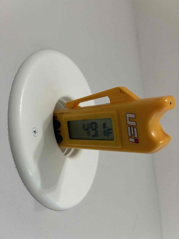 Completed comprehensive HVAC cooling system maintenance inspection. Verified proper system operation by measuring supply air temperature at 49.6°F and monitoring electrical parameters including amp draw of 0.057A and voltage reading of 106.2V. All measurements indicated normal operating conditions with adequate cooling performance and proper electrical function.