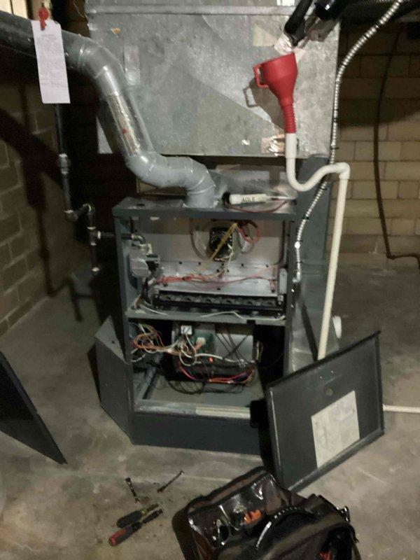 Performed comprehensive cooling season tune-up on residential HVAC system. Conducted detailed inspection of furnace unit with blower assembly, verified all electrical connections and control board functionality using digital multimeter to ensure proper voltage readings, and tested system components for optimal performance. All equipment found operating within manufacturer specifications with no issues identified.