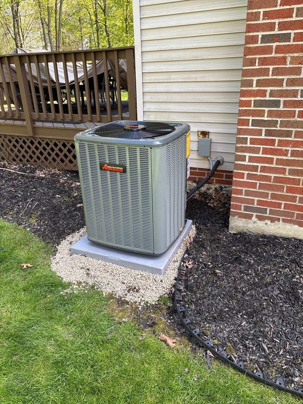 Completed full HVAC system installation including 96% efficiency furnace, air conditioning unit, and humidifier. Installed Daikin outdoor condensing unit on concrete pad with proper gravel surround for drainage and vibration dampening. Mounted unit against exterior wall with appropriate clearances, installed electrical disconnect box and conduit per code requirements. Connected refrigerant lines with brass service valves and proper insulation. Verified all electrical connections, refrigerant charge levels, and system operations. System commissioned and tested for proper airflow, temperature differential, and humidity control functionality.