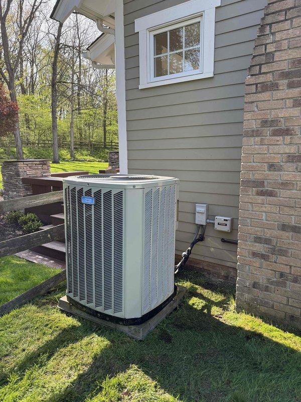 # HVAC Cooling Maintenance Completed

Performed comprehensive cooling system maintenance on residential split-system air conditioning unit. Conducted thorough inspection of outdoor condenser unit positioned on concrete pad, verifying proper clearance and level installation. Checked electrical disconnect, examined refrigerant line insulation integrity, and inspected conduit connections. 

Accessed indoor air handler and evaporator coil assembly located in basement mechanical room. Removed furnace access panel to inspect internal cooling components, including evaporator coil and associated ductwork. Verified proper operation of condensate drain system with PVC drain lines. Inspected refrigerant line connections at indoor unit, confirming black insulation wrap on suction line remains intact.

System operating within normal parameters. All components inspected and found to be functioning properly for continued cooling season operation.