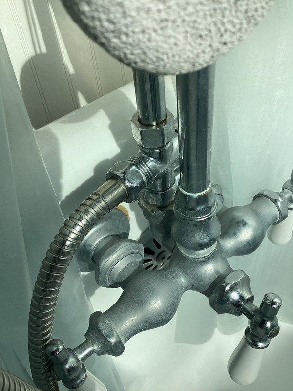 Performed routine maintenance flush on tanked water heater to remove sediment buildup and ensure optimal performance. Customer inquired about follow-up regarding a replacement part for upstairs shower handheld shower head that was to be ordered during previous visit; will coordinate with office to address outstanding order and schedule installation.