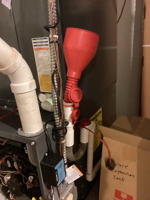 Completed comprehensive afternoon cooling system maintenance and hot water heater servicing. Performed routine inspection and maintenance procedures on HVAC equipment located in mechanical room, including refrigerant line inspection and condensate drain system check. Conducted hot water heater maintenance including drain valve servicing, with drainage hose connected to bottom unit for flushing sediment buildup from tank.