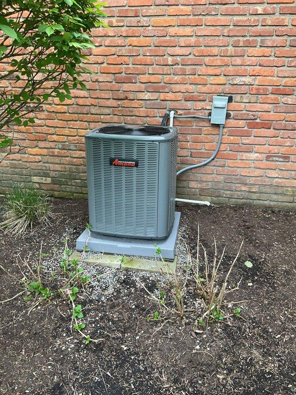 Completed comprehensive cooling maintenance on two residential air conditioning systems. Performed standard preventive maintenance procedures including inspection of both outdoor condenser units, one beige/tan unit showing age-related rust on lower casing and one gray Amana unit mounted on concrete pad against brick wall. Verified proper operation of all components, checked electrical connections at disconnect boxes, and inspected refrigerant line sets. Both systems operational and ready for cooling season.