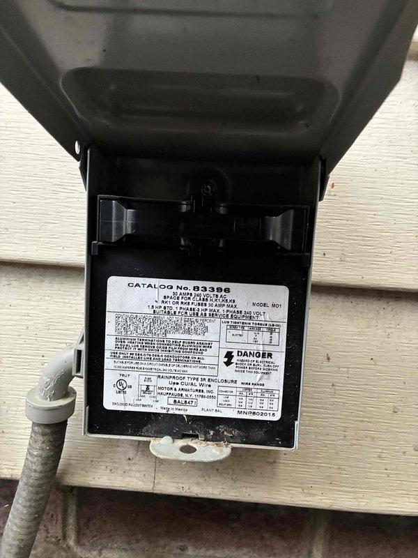 Performed routine HVAC cooling maintenance on residential condensing unit. Inspected condenser fan motor and housing, verifying proper mounting and electrical connections per manufacturer specifications including catalog number 83396. Examined motor shaft, bearings, and cooling fin assembly for wear and operational integrity. Cleaned accumulated dust and debris from cooling fins to ensure optimal heat dissipation and system efficiency. Verified all safety labels and electrical specifications remain legible and compliant. Unit operating within normal parameters upon completion of maintenance service.