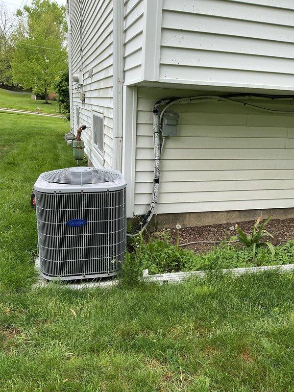 Completed scheduled cooling system maintenance on residential air conditioning unit. Performed comprehensive inspection of outdoor condenser unit, verified proper refrigerant line connections and insulation integrity, and documented temperature readings on copper refrigerant lines using digital thermometer showing 47°F. All components operating within normal parameters with no issues identified.
