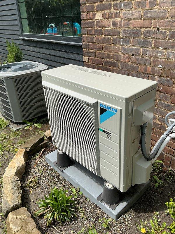 Completed preventive maintenance on three outdoor condensing units, including one Daikin condenser and two additional cooling systems. Performed standard cooling season inspection procedures on all exterior units, verified refrigerant line connections, and inspected electrical conduit routing. Indoor ductless mini-split head unit was visually inspected and confirmed operational.