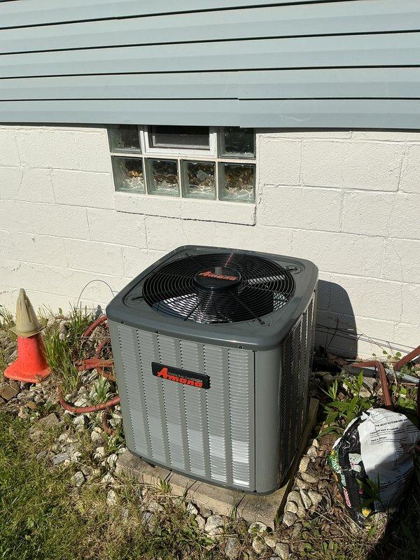 Completed annual maintenance visit on residential heating and cooling system including both furnace and air conditioning units per service protection plan agreement. Performed comprehensive inspection of outdoor Amana condenser unit, verifying proper operation of compressor, fan motor, and electrical connections. Inspected indoor furnace components including blower motor assembly, control board wiring, and safety connections with yellow wire nuts securing multiple circuit groups. All electrical connections tested and found secure, system controls operating within normal parameters, and both heating and cooling equipment functioning properly at time of service.