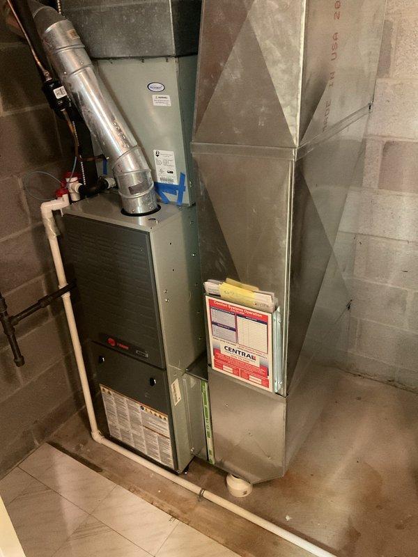 Performed comprehensive cooling system tune-up on residential HVAC unit located in basement utility room. Completed standard maintenance procedures including inspection of furnace unit, refrigerant lines, ductwork connections, and overall system operation to ensure optimal performance for the cooling season.