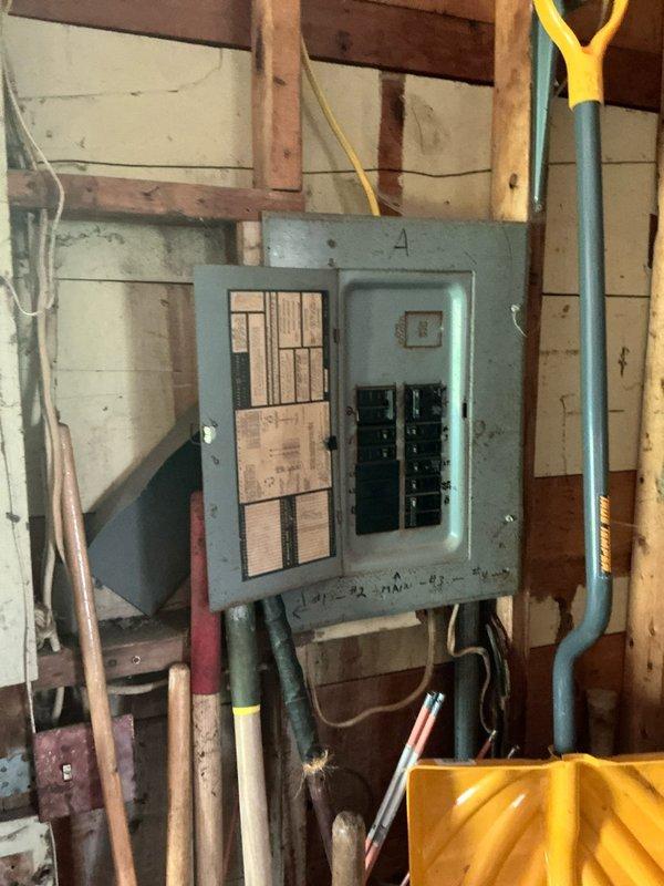 Conducted site assessment for air conditioning installation in residence currently equipped with baseboard heating. Evaluated attic space containing existing air handler unit, ductwork configuration, and insulation conditions. Reviewed electrical panel capacity and available circuits to determine infrastructure requirements for proposed AC system options.