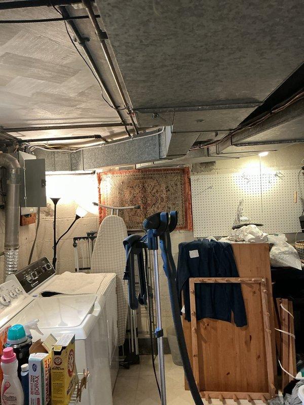 Conducted on-site assessment for electrical service upgrade and EV charging station installation. Evaluated existing electrical panel location in basement utility area and identified optimal exterior mounting location for 48-amp Level 2 electric vehicle charger on side of residence near AC condenser unit. Inspected current electrical service capacity and determined requirements for upgrading to 200-amp main service panel with integrated surge protection. Documented existing conditions including panel accessibility, conduit routing pathways, and exterior installation site. Prepared comprehensive estimate for complete electrical service upgrade and EVSE installation.