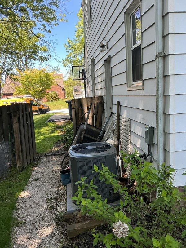 Conducted on-site assessment for electrical service upgrade and EV charging station installation. Evaluated existing electrical panel location in basement utility area and identified optimal exterior mounting location for 48-amp Level 2 electric vehicle charger on side of residence near AC condenser unit. Inspected current electrical service capacity and determined requirements for upgrading to 200-amp main service panel with integrated surge protection. Documented existing conditions including panel accessibility, conduit routing pathways, and exterior installation site. Prepared comprehensive estimate for complete electrical service upgrade and EVSE installation.