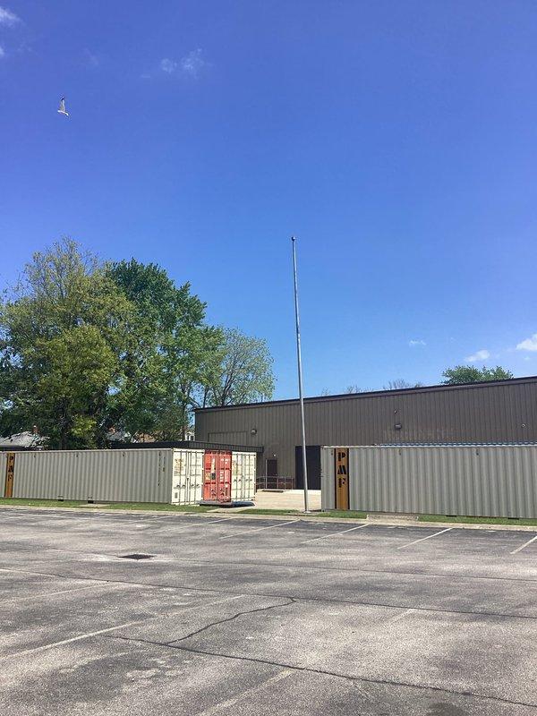 Conducted site assessment for installation of light fixture on exterior flagpole at commercial facility. Evaluated existing pole structure, concrete base mounting, electrical routing requirements from building to pole location across parking lot and landscaped areas, and determined specifications needed for proper illumination and code-compliant installation.
