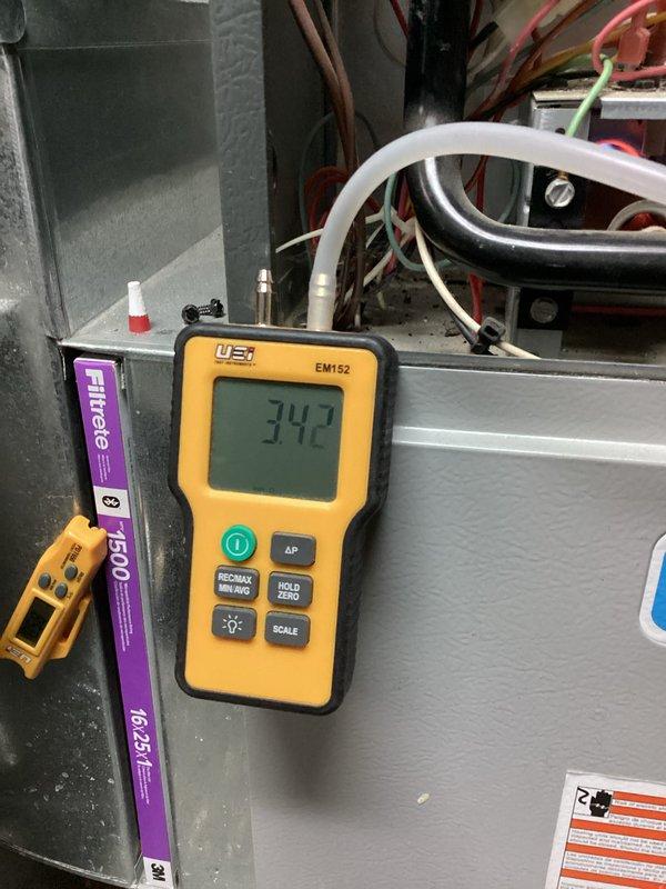 Completed comprehensive HVAC heating system and water heater maintenance inspection. Performed system diagnostics using calibrated digital manometer, recording pressure readings of 742 to verify proper airflow and system performance. Inspected Filtrete 1500 MPR air filter (18.25x15) and evaluated furnace components including electrical connections, gas lines, and copper piping throughout the mechanical room to ensure safe and efficient operation.