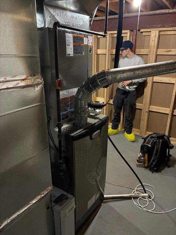 Completed full HVAC system installation including Lennox 80% efficiency furnace, air conditioning unit, chimney liner, and humidifier in basement mechanical room. All equipment professionally mounted, connected to new metallic ductwork with proper transitions and plenums, and tested for optimal performance. System commissioned and operational with all components functioning to manufacturer specifications.